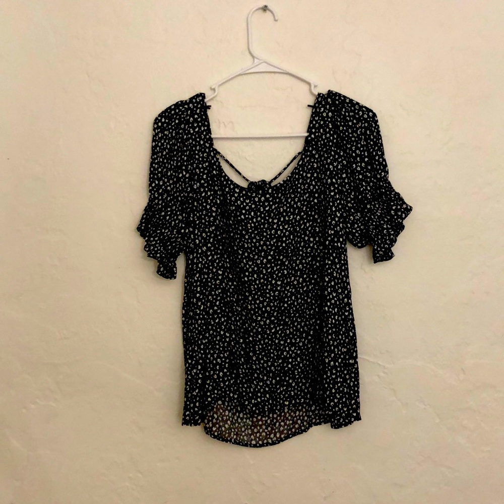 Nice dress shirt, cross cross in the back, designs on top of black, very elegant